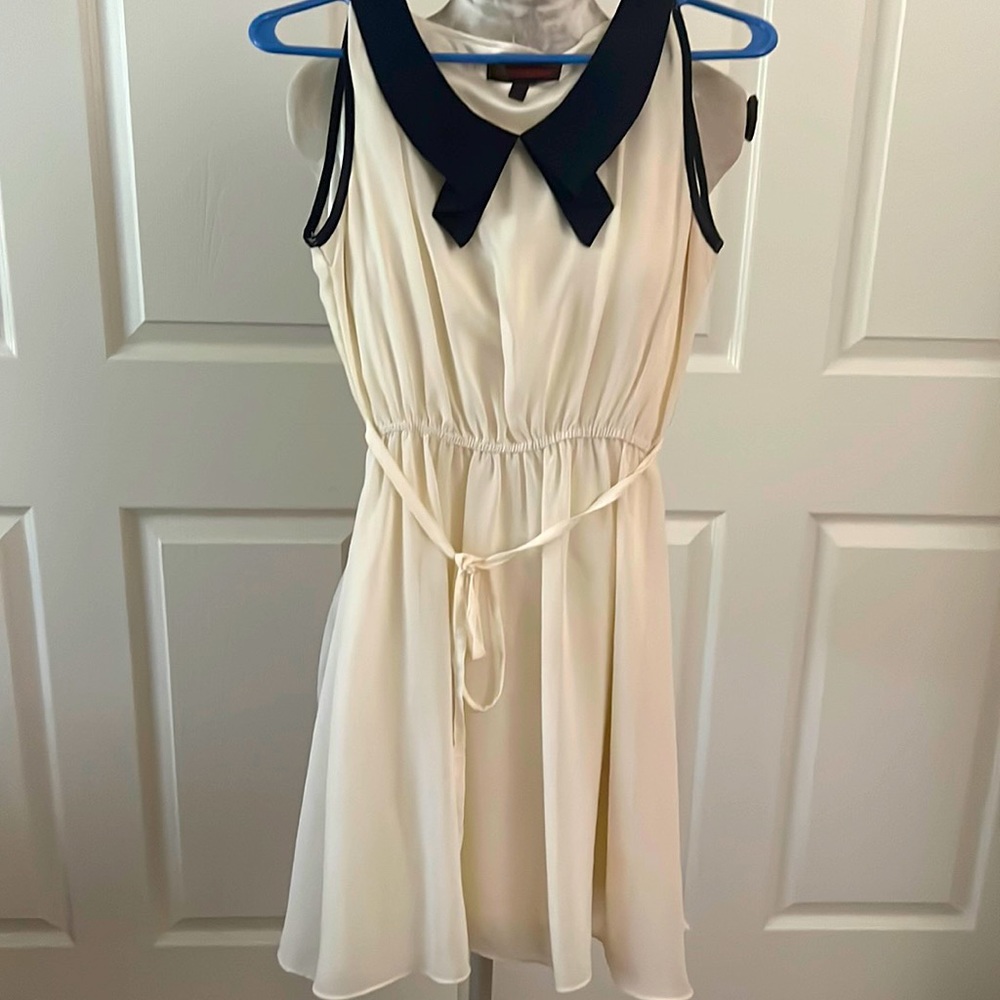 Cream baby doll dress with navy blue collar